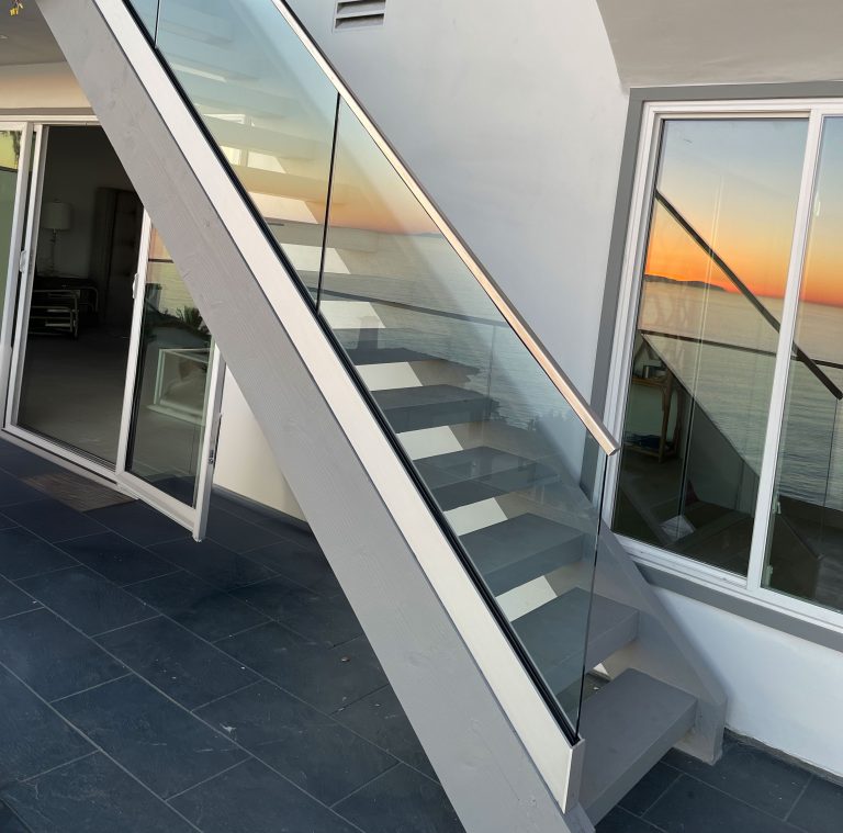 Glass staircase with transparent risers.