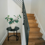 Wooden staircase with sleek black railings