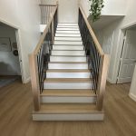 A beautifully crafted craftsman staircase featuring rich wood tones and classic details.
