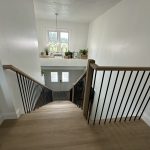 A beautifully crafted craftsman staircase featuring rich wood tones and classic details.