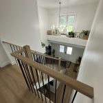 A beautifully crafted craftsman staircase featuring rich wood tones and classic details.
