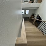 A beautifully crafted craftsman staircase featuring rich wood tones and classic details.