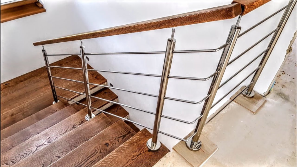 Stainless steel and coated metal staircase components designed to resist corrosion in coastal, salty air