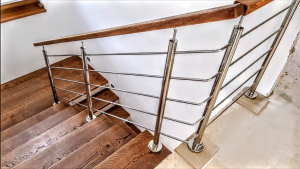 Stainless steel and coated metal staircase components designed to resist corrosion in coastal, salty air