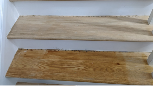 Wood staircase treads with stain samples showing a side-by-side comparison of staircase stain colors before final selection.
