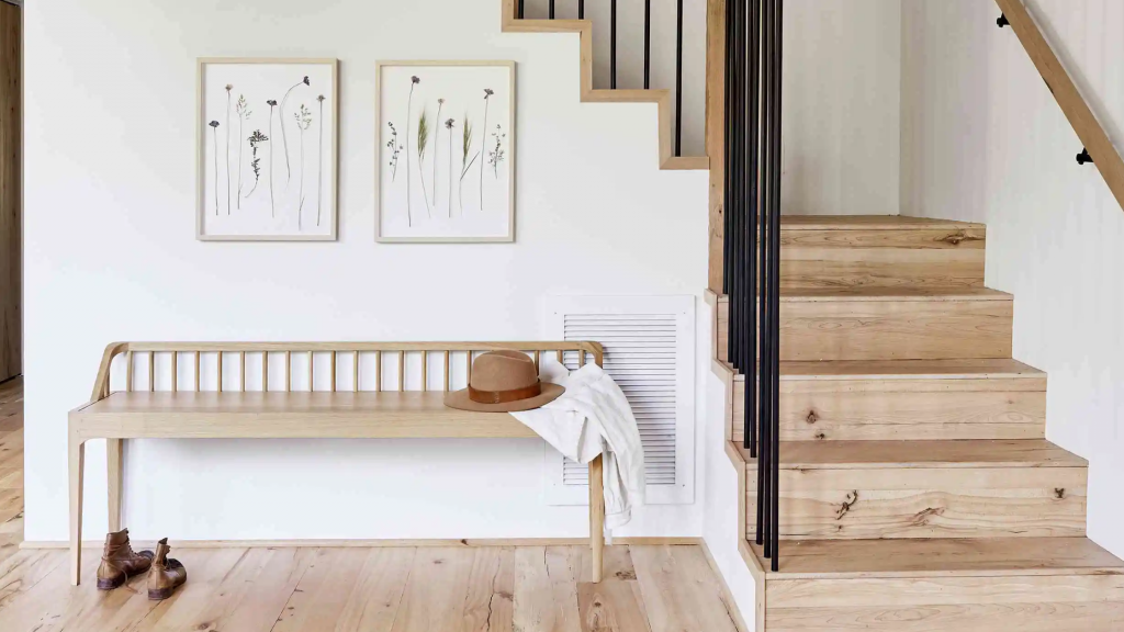 Bright, airy staircase renovation featuring natural light, custom wood stairs, modern railings, and an open-concept design.