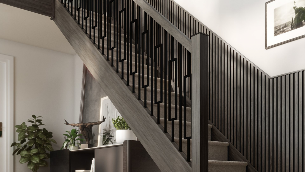 Modern black staircase with custom metal balusters, dark wood handrail, and contemporary wall paneling in a stylish home interior.
